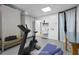 Virtually staged home gym features fitness equipment, providing a dedicated workout space at 800 Shady Lawn Rd, Chapel Hill, NC 27514
