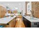 Bright, open kitchen featuring a large island, skylight, and modern appliances at 800 Shady Lawn Rd, Chapel Hill, NC 27514