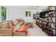 Cozy living room with comfortable seating, shelving unit, and ample natural light at 800 Shady Lawn Rd, Chapel Hill, NC 27514