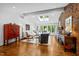 Spacious living room featuring a brick fireplace, skylights, and large windows at 800 Shady Lawn Rd, Chapel Hill, NC 27514