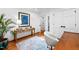 Bright office space with bamboo console table, accent art, and wood floors, blending functionality with style at 800 Shady Lawn Rd, Chapel Hill, NC 27514