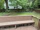 Fenced backyard with bench and mature shade trees at 803 W Club Blvd, Durham, NC 27701