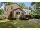Exterior shot of the home featuring a wooden deck and lush, green backyard at 803 W Club Blvd, Durham, NC 27701