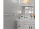 Clean bathroom featuring a white vanity, mirror, and floral decorations at 803 W Club Blvd, Durham, NC 27701
