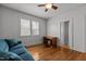 Inviting bedroom with hardwood floors, a window view, and a writing desk at 803 W Club Blvd, Durham, NC 27701