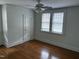 Hardwood-floored bedroom illuminated by natural light through a pair of windows at 803 W Club Blvd, Durham, NC 27701