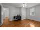 Bedroom featuring a ceiling fan, hardwood floors, natural light and an adjacent room at 803 W Club Blvd, Durham, NC 27701