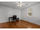Bedroom featuring hardwood floors, a ceiling fan, and a window providing natural light at 803 W Club Blvd, Durham, NC 27701