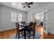 Traditional dining room with hardwood floors, a ceiling fan, and seating for four at 803 W Club Blvd, Durham, NC 27701