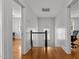 Bright hallway showcasing hardwood floors, neutral walls, and natural light from the window at 803 W Club Blvd, Durham, NC 27701