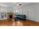 Comfortable living room featuring a fireplace and hardwood floors, with plenty of natural light at 803 W Club Blvd, Durham, NC 27701