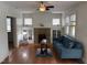 Inviting living room featuring a fireplace, hardwood floors, and ample natural light at 803 W Club Blvd, Durham, NC 27701