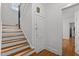 Staircase featuring wooden steps and a secure storage area underneath at 803 W Club Blvd, Durham, NC 27701