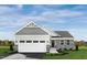 Charming one-story home with stone accents, attached garage, and a beautifully landscaped yard at 84 Saintsbury Dr, Fuquay Varina, NC 27526