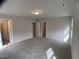Bedroom with carpet and access to the bathroom and closet at 909 Clearhaven Ln # 909, Fuquay Varina, NC 27526