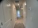 Hallway with carpet and access to rooms with white doors at 909 Clearhaven Ln # 909, Fuquay Varina, NC 27526
