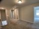 Upstairs hallway with access hatch, carpeted floors, and natural lighting at 909 Clearhaven Ln # 909, Fuquay Varina, NC 27526