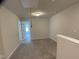 Upstairs hallway featuring carpet, natural light, and nearby bedrooms at 909 Clearhaven Ln # 909, Fuquay Varina, NC 27526