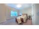 This bedroom features a cozy bed, a window with view, and a telescope for stargazing at 99 Grassy Creek Way, Chapel Hill, NC 27517