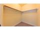 Walk-in closet offering ample storage space with a simple rod and shelf setup for organization at 99 Grassy Creek Way, Chapel Hill, NC 27517