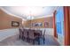 Spacious dining room featuring wainscoting, a chandelier, and large windows at 99 Grassy Creek Way, Chapel Hill, NC 27517