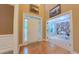 Inviting foyer with hardwood floors, complemented by views into the library at 99 Grassy Creek Way, Chapel Hill, NC 27517