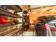 Neat garage with shelves, Tesla car, and wall storage, offering organized space at 99 Grassy Creek Way, Chapel Hill, NC 27517