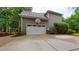 Detached two-car garage features a basketball hoop and convenient driveway access at 99 Grassy Creek Way, Chapel Hill, NC 27517
