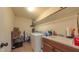 Functional laundry room with washer, dryer, sink, cabinet storage, and convenient shelving for organization at 99 Grassy Creek Way, Chapel Hill, NC 27517