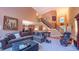 Spacious living room featuring a staircase, view of the kitchen, and comfortable seating at 99 Grassy Creek Way, Chapel Hill, NC 27517