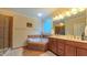 Bright and spacious main bathroom featuring a soaking tub, double vanity, and tile flooring at 99 Grassy Creek Way, Chapel Hill, NC 27517