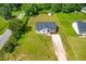 Aerial view of property with lawn and outbuildings at 101 Kristina Dr, Selma, NC 27576
