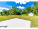 A backyard patio and lawn with a shed at 101 Kristina Dr, Selma, NC 27576