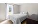 Bright bedroom with a full size bed, neutral decor and large window for natural light at 101 Kristina Dr, Selma, NC 27576