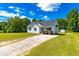 Charming home with a long driveway and lush green yard, complemented by blue shutters at 101 Kristina Dr, Selma, NC 27576