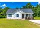 Charming single-story home with blue shutters, well-maintained lawn, and inviting curb appeal at 101 Kristina Dr, Selma, NC 27576
