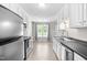 Bright, spacious kitchen with ample counter space, stainless steel appliances and a view to breakfast nook at 101 Kristina Dr, Selma, NC 27576