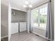 Convenient laundry room features a washer and dryer, brightened by a large window at 101 Kristina Dr, Selma, NC 27576