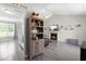 Cozy living room showcasing a fireplace, vaulted ceiling, and modern gray flooring at 101 Kristina Dr, Selma, NC 27576