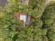 Aerial view of home with private pool and wooded lot offers serenity and seclusion at 102 Mel Oak Dr, Chapel Hill, NC 27516