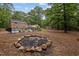 Large backyard with a fire pit, great for outdoor entertaining at 102 Mel Oak Dr, Chapel Hill, NC 27516