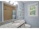 Cozy bathroom with granite vanity, a shower-tub combo, and natural light at 102 Mel Oak Dr, Chapel Hill, NC 27516