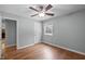 Light-filled bedroom features a ceiling fan and a neutral color palette at 102 Mel Oak Dr, Chapel Hill, NC 27516