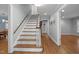 Inviting entryway featuring hardwood floors, staircase, and neutral wall paint at 102 Mel Oak Dr, Chapel Hill, NC 27516