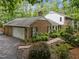 Beautiful brick home with an attached garage and mature landscaping at 102 Mel Oak Dr, Chapel Hill, NC 27516
