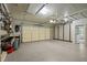 Spacious garage with epoxy flooring and built-in cabinets for organized storage at 102 Mel Oak Dr, Chapel Hill, NC 27516
