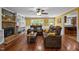 Inviting living room with brick fireplace, built-in bookshelves, and comfortable seating at 102 Mel Oak Dr, Chapel Hill, NC 27516