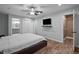 Spacious main bedroom featuring a modern ceiling fan, attached bath, and closet at 102 Mel Oak Dr, Chapel Hill, NC 27516