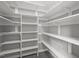 Spacious walk-in pantry features white shelving and ample storage space at 102 Mel Oak Dr, Chapel Hill, NC 27516