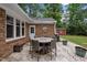 Outdoor patio with dining area ideal for entertaining with ample seating and attractive brickwork at 102 Mel Oak Dr, Chapel Hill, NC 27516